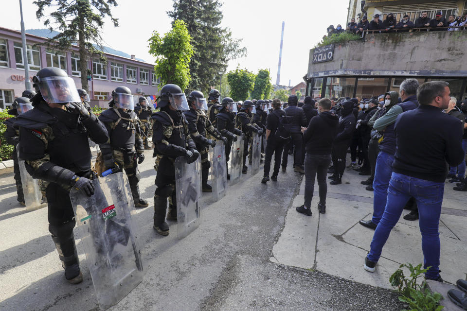 Hungarian soldiers serving in the NATO-led peacekeeping force KFOR guard a municipal building in the town of Zvecan, northern Kosovo, Monday, May 29, 2023. Serbia condemned NATO-led peacekeepers stationed in neighboring Kosovo for their alleged failure to stop "brutal actions" by Kosovo police against ethnic Serbs, and said that its armed forces stationed near the border will remain on the highest state of alert until further notice. (AP Photo/Bojan Slavkovic)