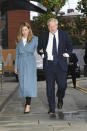 Britain's Prime Minister Boris Johnson arrives, accompanied by partner Carrie Symonds, ahead of the annual scheduled Conservative Party Conference in Manchester, England, Saturday Sept. 28, 2019. The ruling Conservative Party are continuing with their party conference, despite government lawmakers voting against the party request for a three-day recess to allow extra time for the event. (Stefan Rousseau/PA via AP)