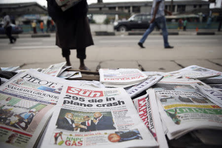Newspapers are seen at a vendor's stand along a road in Ikoyi district in Lagos July 18, 2014. REUTERS/Akintunde Akinleye