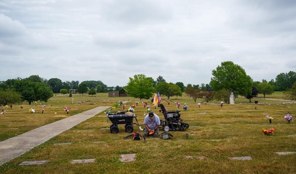 With sanding complete, Rick Brown packs up his tools Thursday, July 7, 2022, and places them back in their place inside his pull cart. Because Brown is disabled, he uses an all-terrain tracked wheelchair by TrackMaster. 