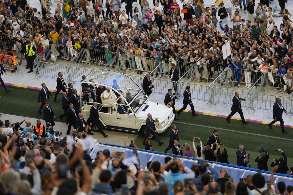 Pope Francis arrives at the "Velodrome Stadium", in Marseille, France, to celebrate mass, Saturday, Sept. 23, 2023. Francis, during a two-day visit, will join Catholic bishops from the Mediterranean region on discussions that will largely focus on migration. (AP Photo/Pavel Golovkin)