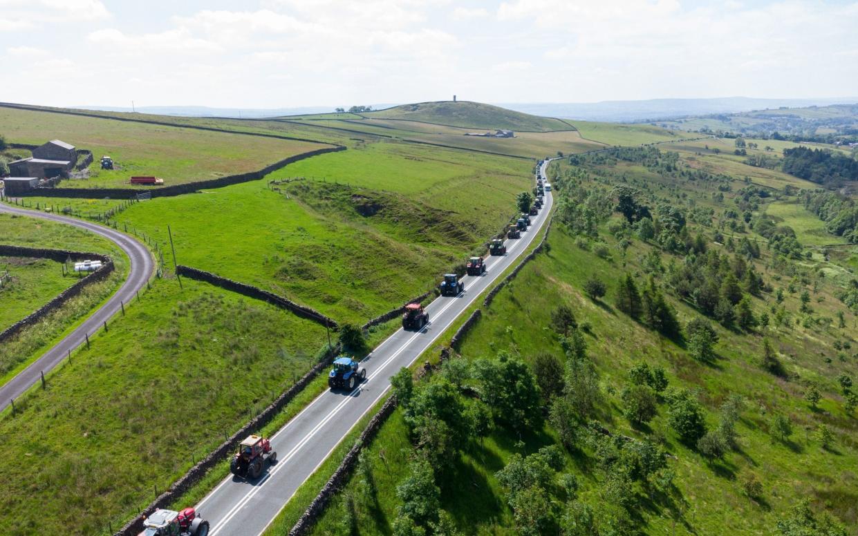 An aerial shot of the tractor procession for Thomas Bull