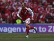 Denmark's Christian Eriksen runs during the Euro 2020 soccer championship group B match between Denmark and Finland at Parken stadium in Copenhagen, Denmark, Saturday, June 12, 2021. Eriksen collapsed on the pitch and received medical assistance before being taken to hospital. (Wolfgang Rattay/Pool via AP)