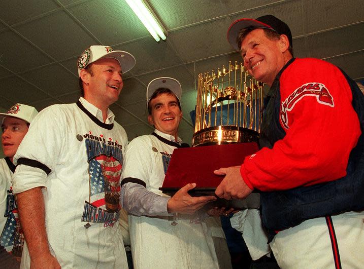 Braves president Stan Kasten, general manager John Schuerholz, and manager Bobby Cox celebrates after winning the 1995 World Series. (AP)