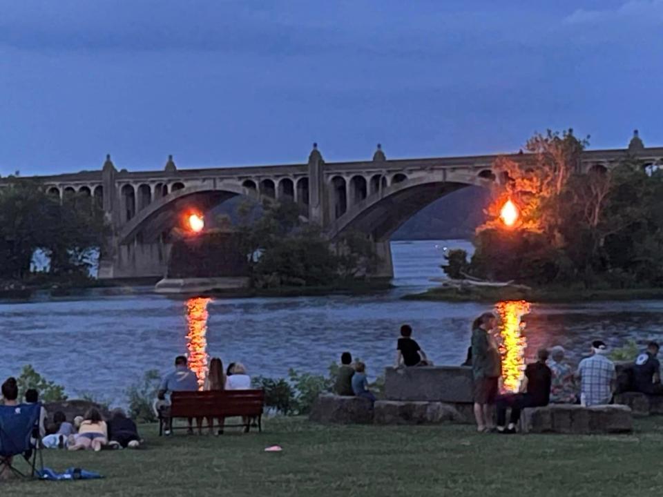 Riverfest 2023 volunteers lit grills atop three piers last weekend as a representation of the Civil War’s burning of the Columbia Bridge 160 years ago.