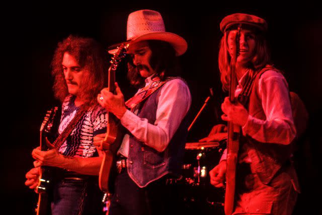 <p>Ed Perlstein/Redferns/Getty</p> Dan Toler, Dickey Betts and Dave Goldflies perform with the Allman Brothers Band at the Oakland Coliseum on May 17, 1979 in Oakland, California.