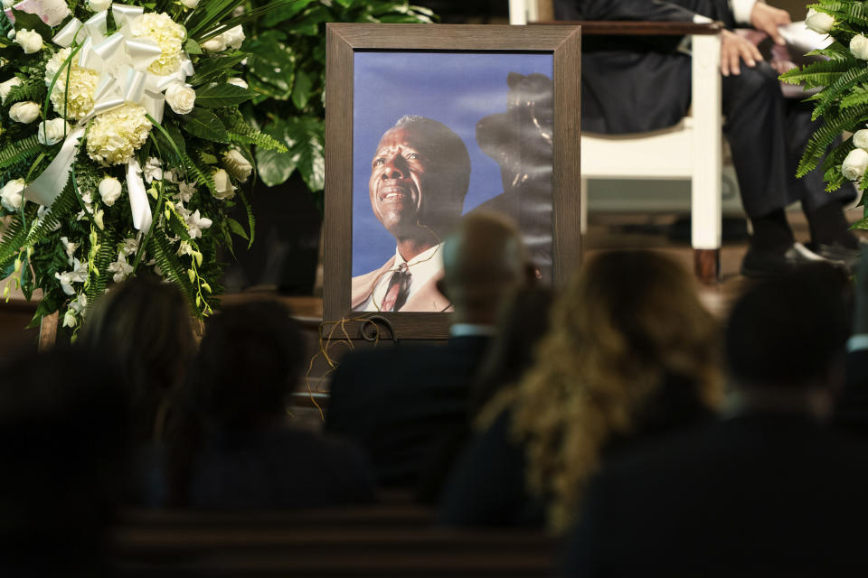 A photograph of Henry "Hank" Aaron, longtime Atlanta Braves player and Hall of Famer, sits outside his casket during his funeral on Wednesday, Jan. 27, 2021 at Friendship Baptist Church in Atlanta. (Kevin D. Liles/Atlanta Braves via AP, Pool)