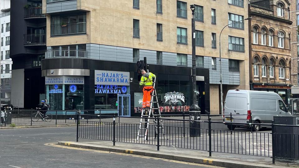 Man fixing traffic lights