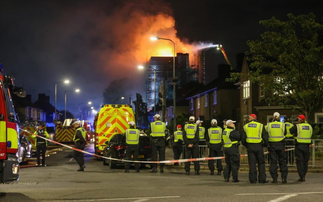 Firefighters at the Dagenham building trying to bring the fire under control