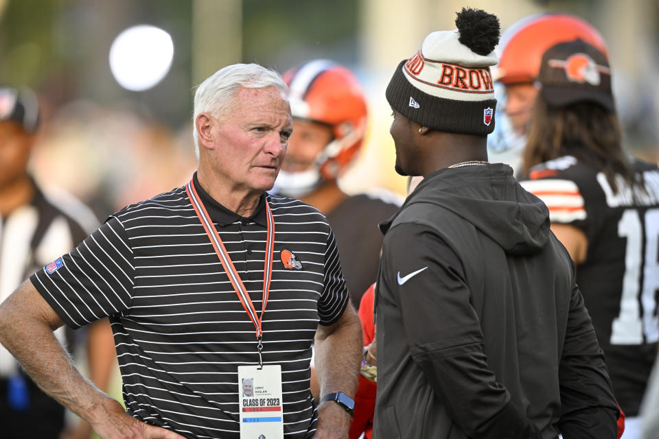 Cleveland Browns owner Jimmy Haslam, left, talks with quarterback Deshaun Watson before the team's Hall of Fame NFL football preseason game against the New York Jets, Thursday, Aug. 3, 2023, in Canton, Ohio. (AP Photo/David Richard)