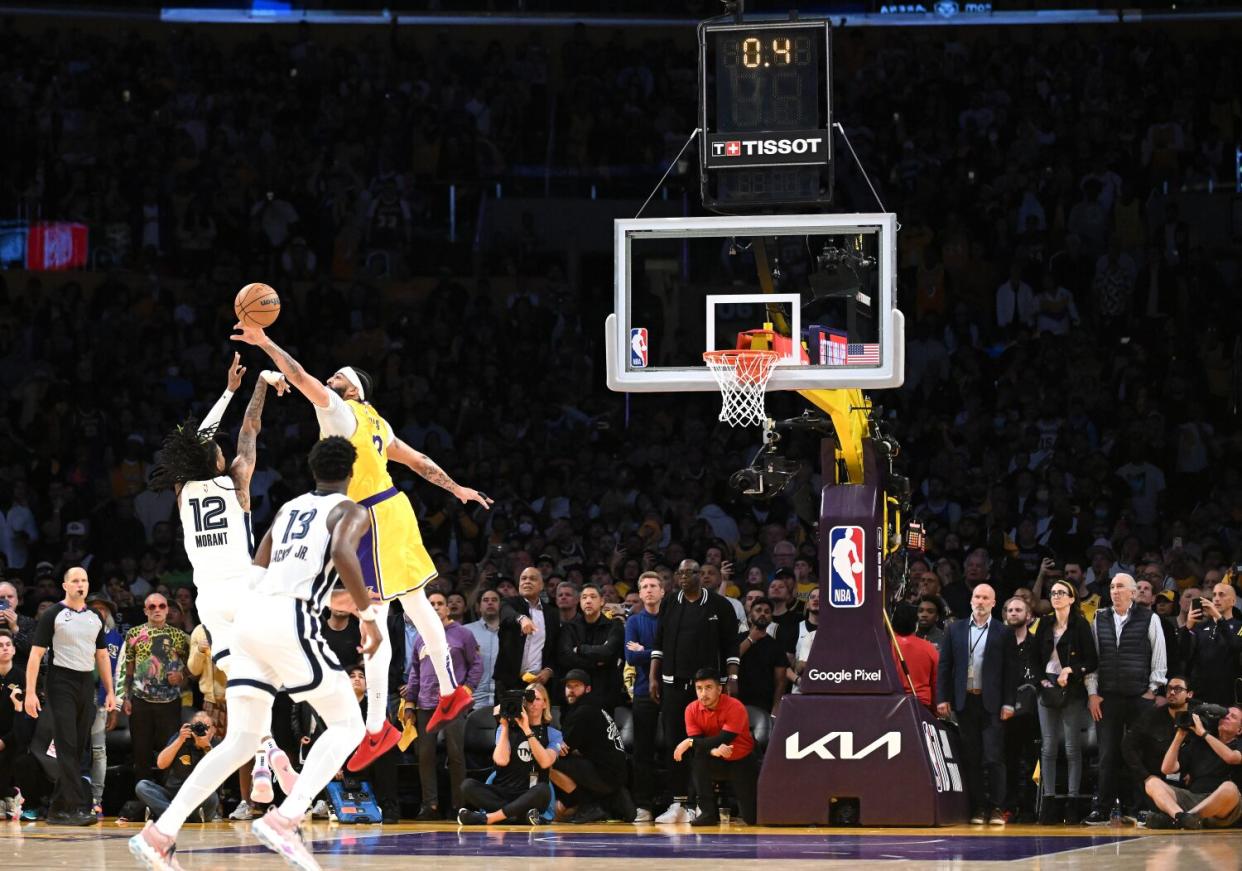 Lakers Anthony Davis blocks the host of Grizzlies Ja Morant in the closing second of the fourth quarter
