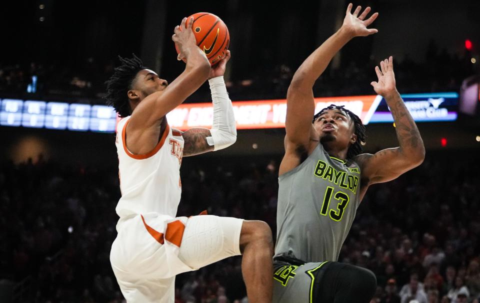 Texas Longhorns guard Tyrese Hunter (4) shoots the ball for two points to win the game over defense from Baylor Bears guard Langston Love (13) in the last seconds of the Longhorns' game against the Baylor Bears at the Moody Center in Austin, Jan 20, 2024.