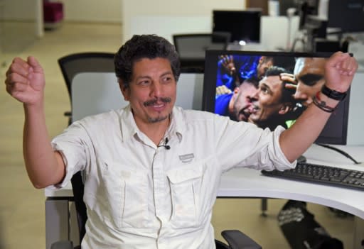 AFP photographer Yuri Cortez, who unwittingly became part of the celebrations of Croatia in their World Cup semi-final match against England, gestures during an interview with AFP in Mexico City