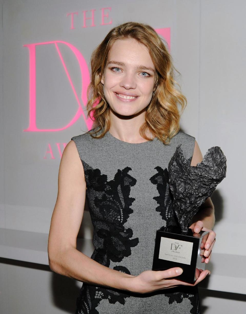 This April 5, 2013 photo released by The DVF Awards shows model Natalia Vodianova with her DVF Award in New York. Vodianova was recognized for her charity with children in her native Russia. She founded a charity called the Naked Heart Foundation in 2004. It started as a project to build a playground for the surviving children of the Beslan school massacre. Since then, it has grown to 90 play parks in 68 Russian towns. (AP Photo/The DVF Awards, Neil Rasmus)