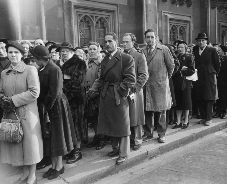 12th February 1952:  Boxer Alex Buxton in the queue of mourners waiting to pay their last respects to the late King George VI, lying in state in Westminster Hall, London.  (Photo by Monty Fresco/Topical Press Agency/Getty Images)