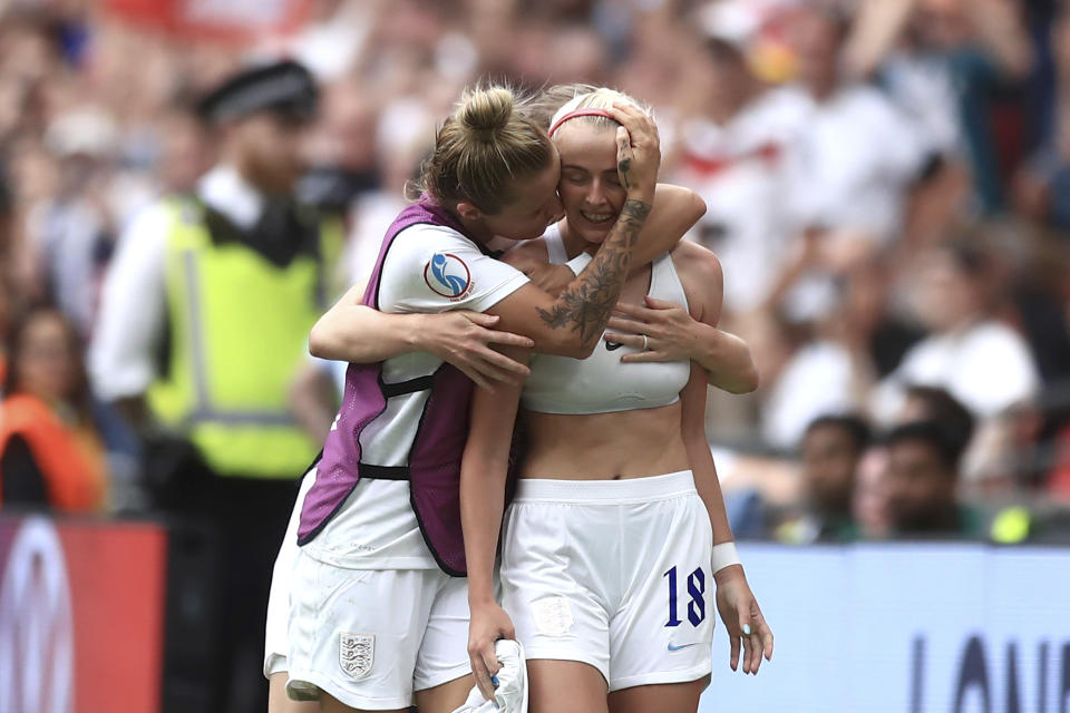 England's Chloe Kelly celebrates after scoring her side's second goal during the Women's Euro 2022 final soccer match between England and Germany at Wembley stadium in London, Sunday, July 31, 2022. (AP Photo/Leila Coker)