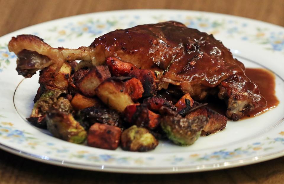 Square Scullery's duck served with winter vegetables, Monday, Jan. 29, 2024, in Akron, Ohio.