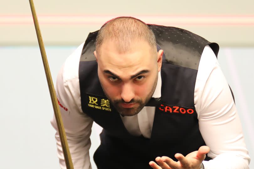 Hossein Vafaei of Iran reacts in the first round match against Judd Trump of England on day two of 2024 Cazoo World Snooker Championship at Crucible Theatre on April 21, 2024 in Sheffield, England. (Photo by Tai Chengzhe/VCG via Getty Images)