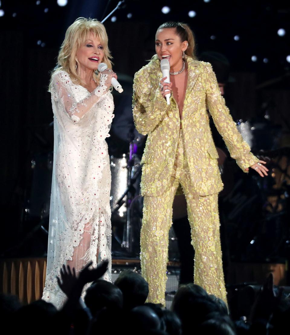 Dolly Parton, left, and Miley Cyrus perform "Jolene" at the 61st annual Grammy Awards on Sunday, Feb. 10, 2019, in Los Angeles.