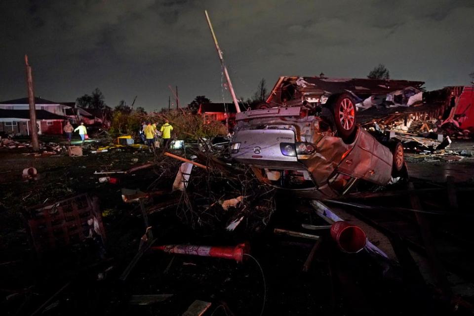 A tornado flipped a car in Arabi, La., on March 22. The storm tore through parts of New Orleans and its suburbs, ripping down power lines and scattering debris in a part of the city that was heavily damaged by Hurricane Katrina 17 years ago.