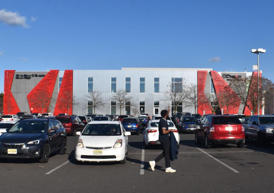 A man walks by the future home of an out-patient facility for Cooper University Health Care at Moorestown Mall.