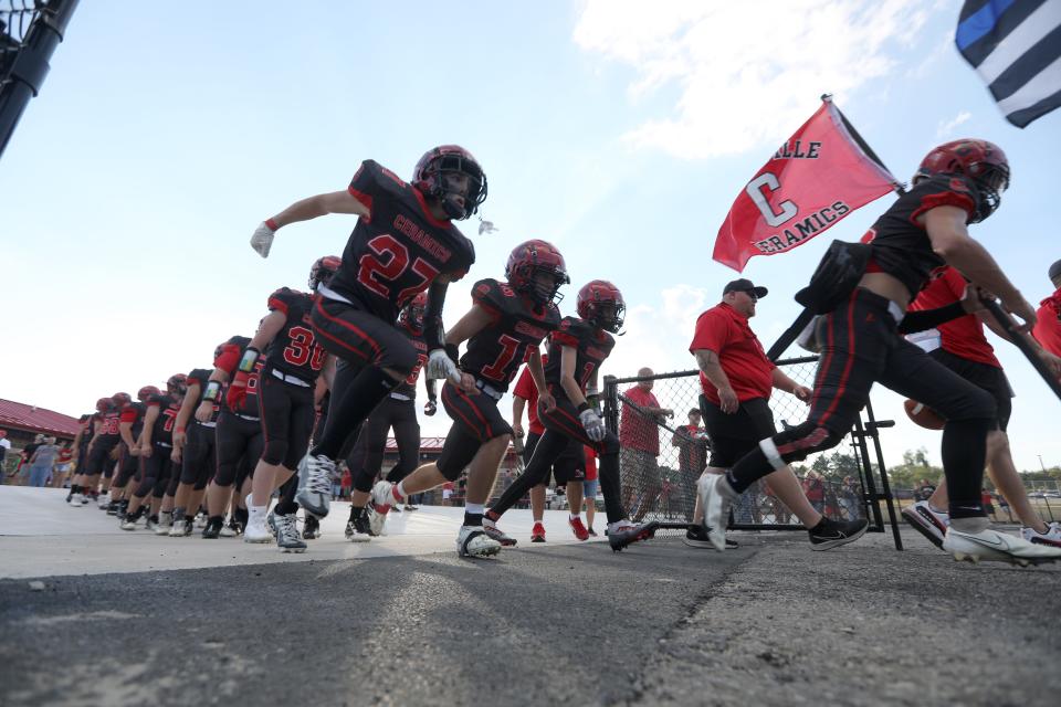 Crooksville takes the field for their seaon opener against Waterford. It was the first game at the school's new stadium.