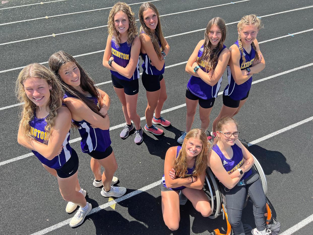 Sarah and Emily Thomas, Malaina and Lily Wolfe, Maddie and Megan Haring and Karis and Natalie Hunter are pairs of sisters on Lexington's Track team.