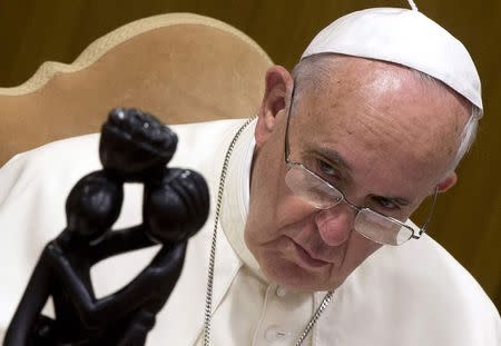 Pope Francis looks on as he leads the synod of bishops in Paul VI's hall at the Vatican October 6, 2014. REUTERS/Claudio Peri/Pool