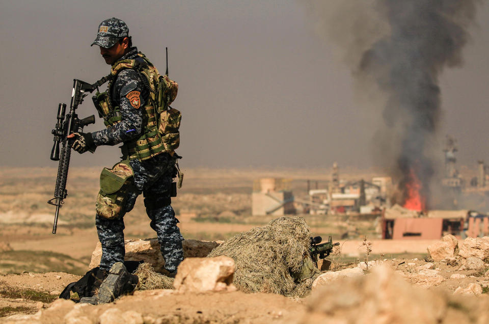Iraqi security forces sniper aims his weapon