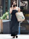 <p>New mom Nikki Bella chats on the phone after stopping by Whole Foods on Monday in L.A. </p>