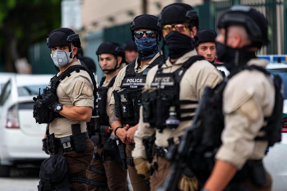 Police officers keep guard as a group of activists participate in a Justice for George Floyd protest near the Richard E. Gerstein Justice Building in Allapattah on Monday, June 1, 2020.