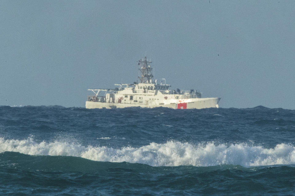 FILE - A U.S. Coast Guard cutter patrols the area of debris on July 2, 2021, from a 737 cargo plane that crashed off Oahu near Honolulu. Federal investigators said Thursday, June 15, 2023, that the cargo plane ditched into the ocean off Hawaii in 2021 was because pilots identified the wrong engine that was failing and didn’t have enough power to remain airborne. (Craig T. Kojima/Honolulu Star-Advertiser via AP, File)