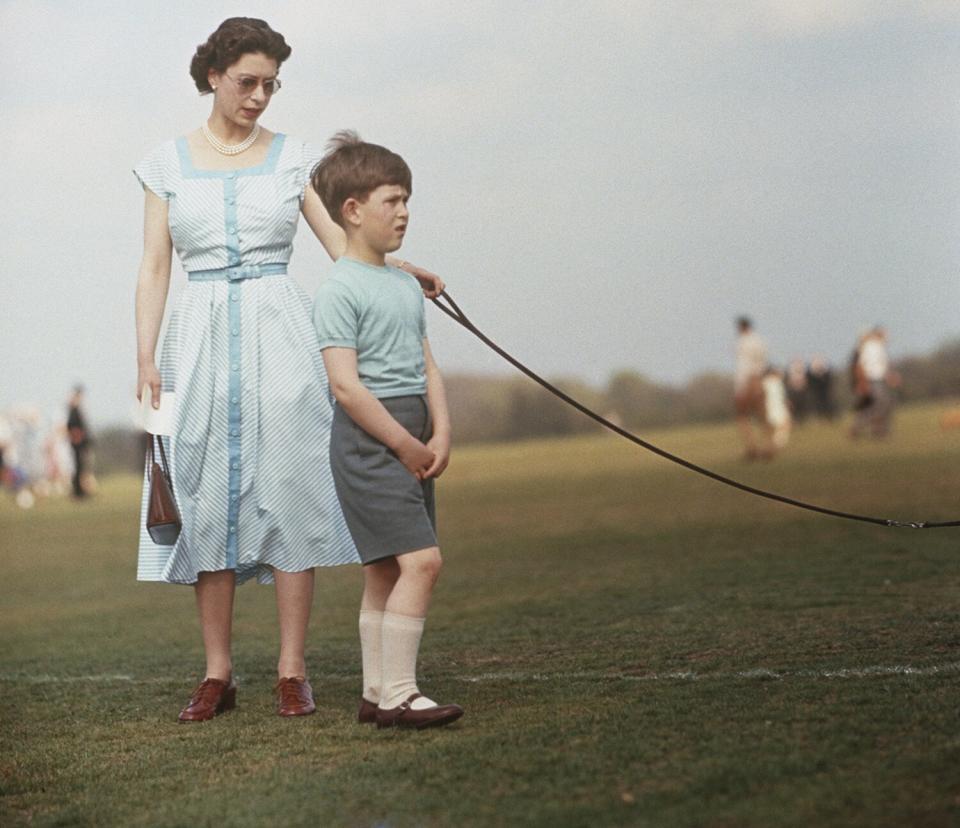 Queen Elizabeth II with Prince Charles at Windsor Great Park, during a polo match, 1956.