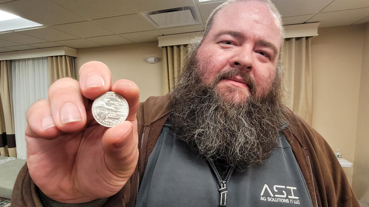 John Southerland, of Spokane, Washington, said that he received a "Washington Crossing the Delaware" quarter in his change on Friday Jan. 12, 2024, it convinced him to drive seven hours from Kansas to hear Vivek Ramaswamy speak in West Des Moines.
