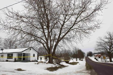 Police tape surrounds one of the crime scenes where gunman, Joseph Jesse Aldridge, killed seven people on Thursday night in Tyrone, Missouri February 27, 2015. REUTERS/Kate Munsch