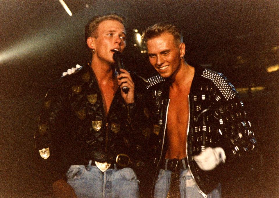 Matt and Luke Goss of Bros perform on stage on ‘The Big Push’ tour at Wembley Arena on December 28th, 1988 in London, England. (Photo by Peter Still/Redferns)