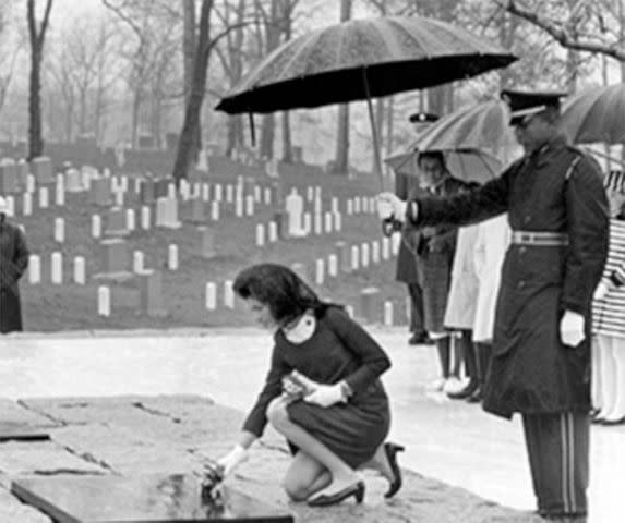 Kennedy Library Jackie Kennedy places flowers on the grave of her husband at Arlington National Cemetery in March 1967. Patrick and their stillborn daughter Arabella lie next to his gravesite.