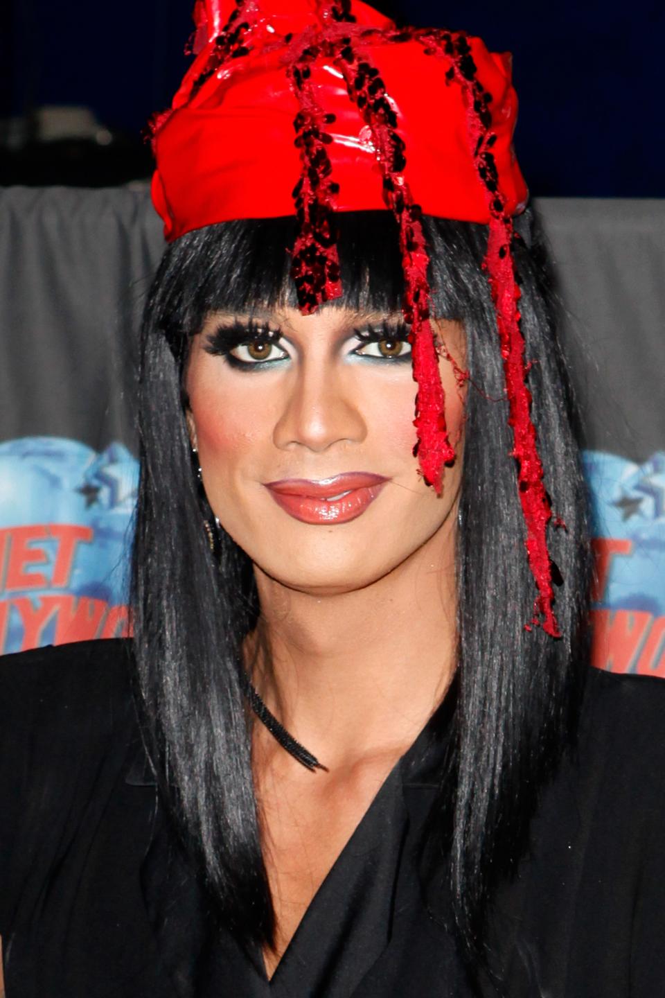 Raja wearing a red hat