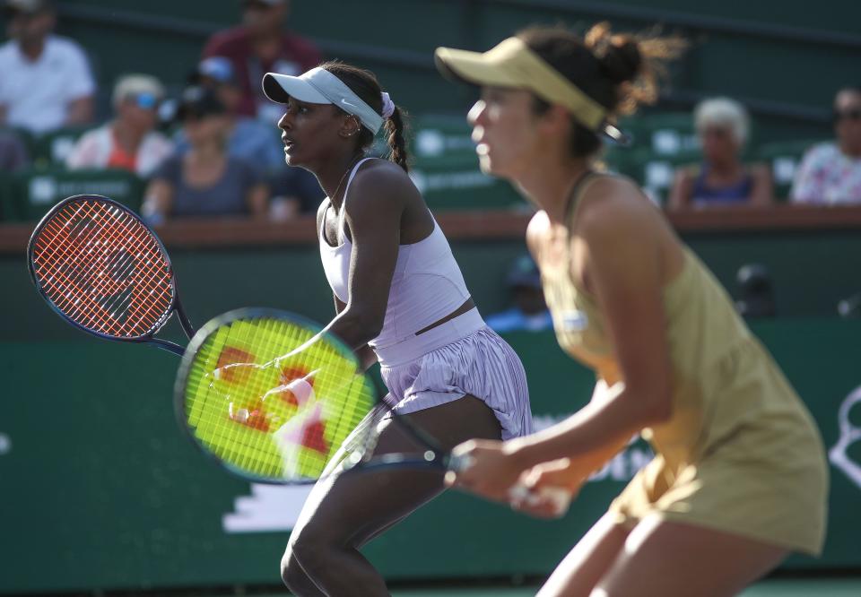 Asia Muhammad, left, and Ena Shibahara play doubles against Coco Gauff and Jessica Pegula during the BNP Paribas Open in Indian Wells, Calif., March 12, 2024.