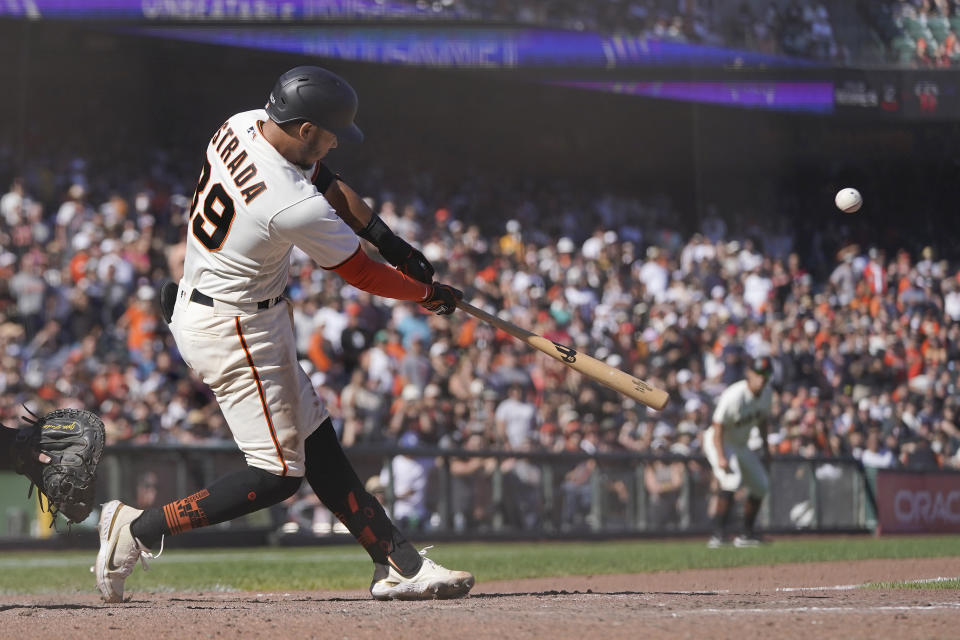 San Francisco Giants' Thairo Estrada hits a two-run home run during the ninth inning of a baseball game against the Pittsburgh Pirates in San Francisco, Sunday, Aug. 14, 2022. (AP Photo/Jeff Chiu)