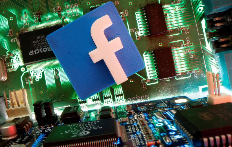 FILE PHOTO: Facebook symbol is seen on a motherboard in this picture illustration