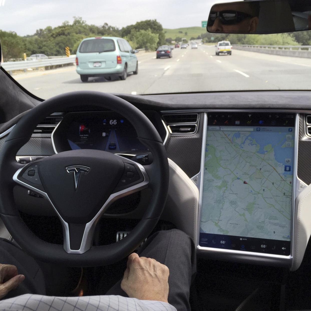 <p>The interior of a Tesla Model S is shown in autopilot mode in San Francisco, California on 7 April, 2016.</p> (REUTERS)