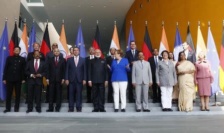 German Chancellor Angela Merkel and Indian Prime Minister Narendra Modi pose with members of their delegations for a family photo ahead of the 4th round of German-Indian government consultation at the Chancellery in Berlin, Germany, May 30, 2017. REUTERS/Hannibal Hanschke