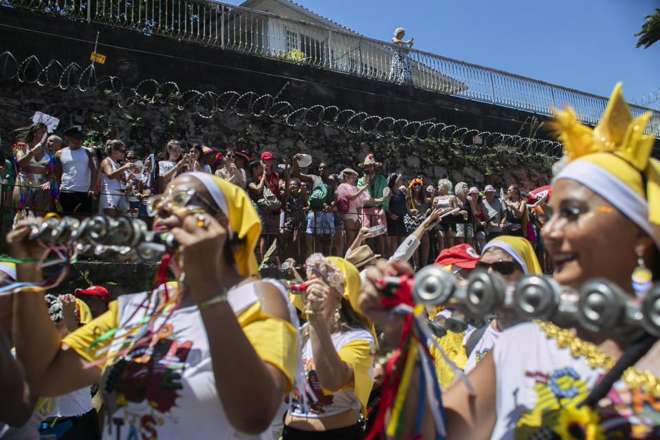 Revelers watch the Carmelitas street party on the first day of Carnival in Rio de Janeiro, Brazil, Friday, Feb. 9, 2024. (AP Photo/Bruna Prado)