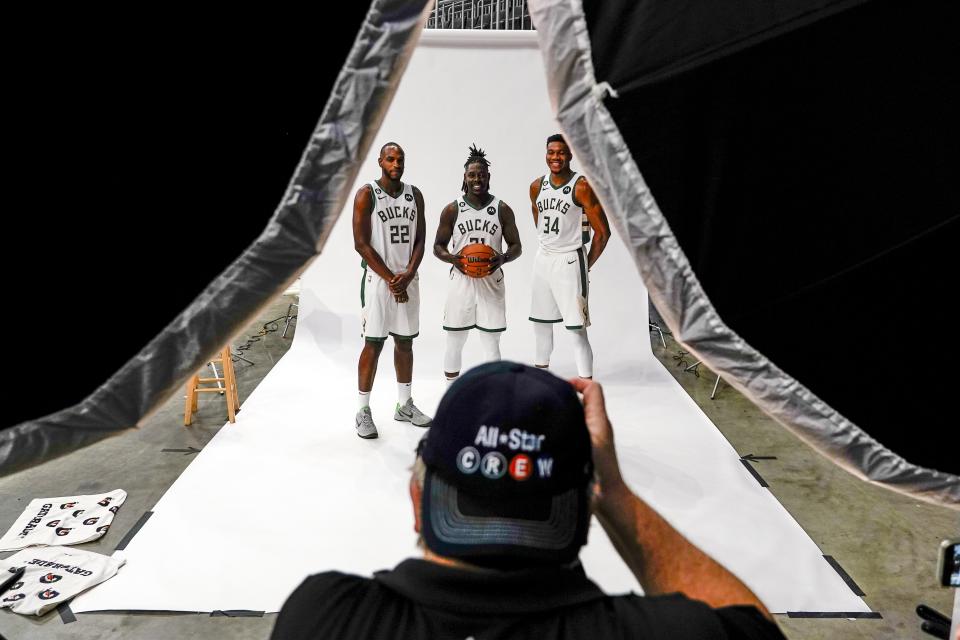 Milwaukee Bucks' Khris Middleton (22), Giannis Antetokounmpo (34) and Jrue Holiday, center, pose for a photograph at the NBA basketball team's media day Sunday, Sept. 25, 2022, in Milwaukee. (AP Photo/Morry Gash)