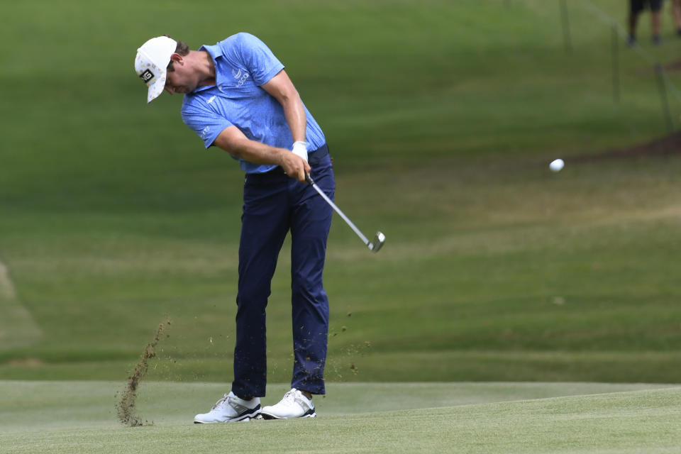 Harris English hits on the first hole during the third round in the World Golf Championship-FedEx St. Jude Invitational tournament, Saturday, Aug. 7, 2021, in Memphis, Tenn. (AP Photo/John Amis)