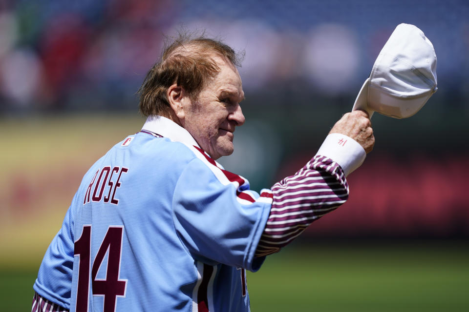 FILE - Former Philadelphia Phillies player Pete Rose tips his hat to fans during an alumni day, Aug. 7, 2022, in Philadelphia. (AP Photo/Matt Rourke, File)