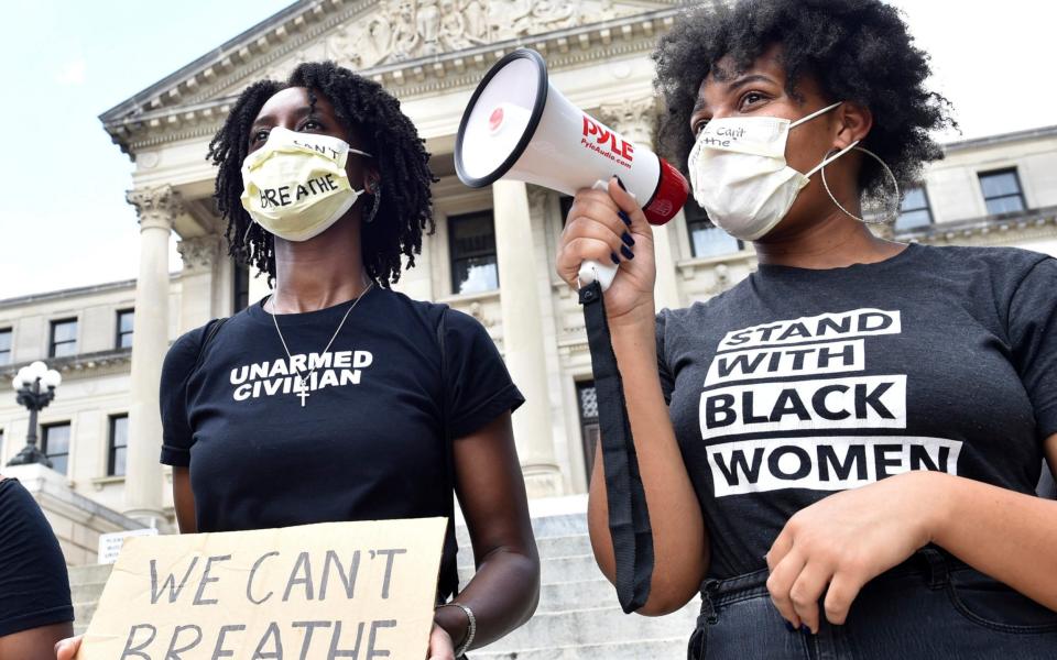 Protesters chant outside the Mississippi State Capitol building -  The Clarion-Ledger