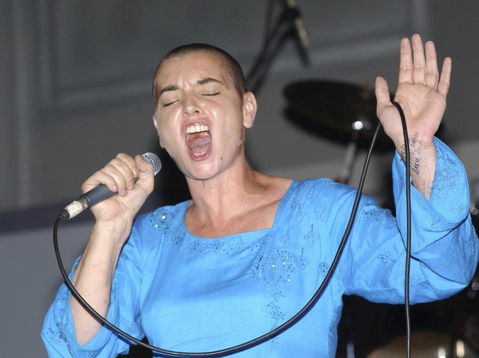 FILE - Irish singer Sinead O'Connor performs at the Prime Minister Independence Gala in Kingston, Jamaica on Aug. 6, 2005. O’Connor, the gifted Irish singer-songwriter who became a superstar in her mid-20s but was known as much for her private struggles and provocative actions as for her fierce and expressive music, has died at 56. The singer's family issued a statement reported Wednesday by the BBC and RTE. (AP Photo/Collin Reid, File)