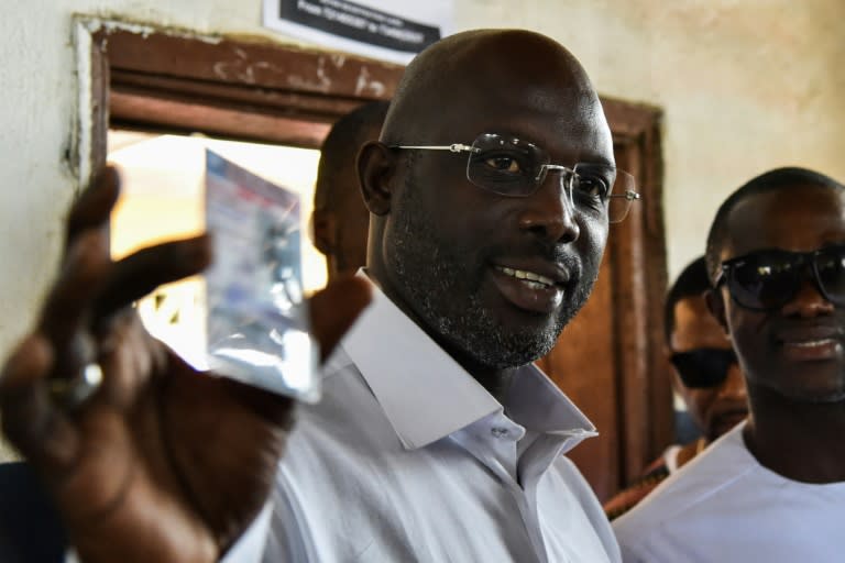 Weah in the running: Former international Liberian football star George Weah will go head-to-head with Joseph Boakai for the Liberian presidency